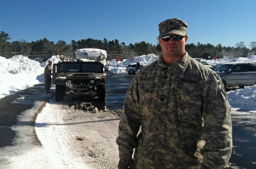 Specialist Christopher Graham of the National Guard has been helping transport evacuees from around the South Shore to a temporary shelter the Furnace Brook Middle School in Marshfield. (Andrea Shea/WBUR)