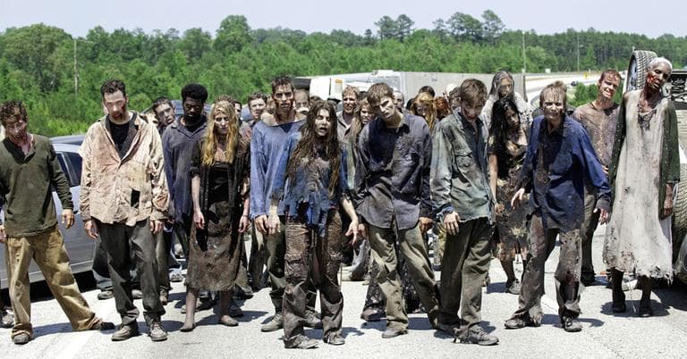 In this image released by AMC, zombies appear in a scene from the second season of the AMC series &quot;The Walking Dead.&quot; (Gene Page/AMC/AP)