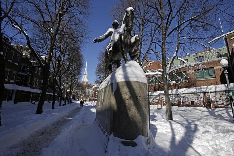 A statue of Paul Revere stands in front of the Old North Church, rear left, in Paul Revere Mall in the North End neighborhood of Boston Sunday, Feb. 10, 2013. (Gene J. Puskar/AP)