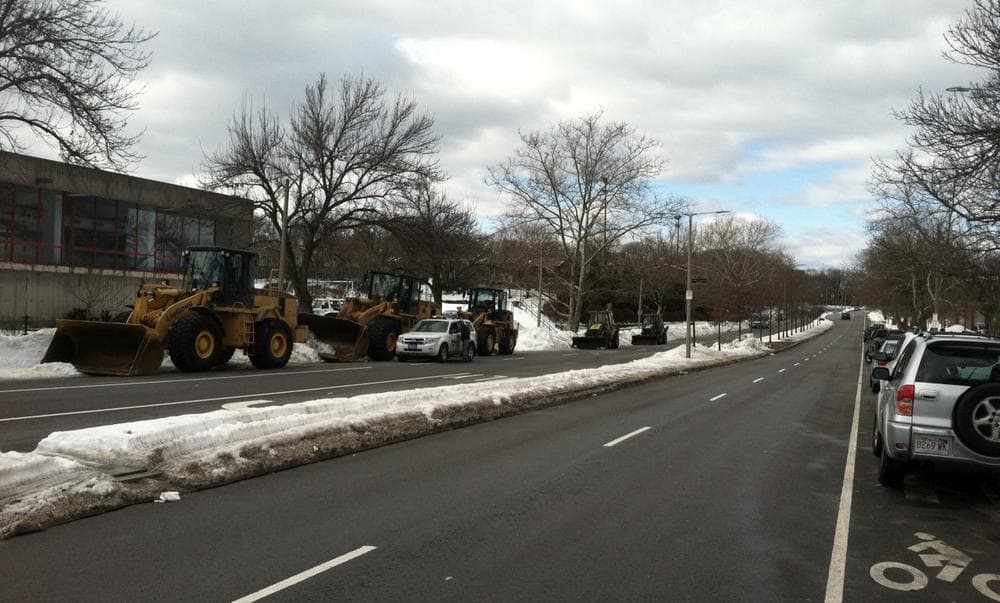 A line of snow removal equipment sits along Martin Luther King Boulevard Tuesday afternoon. (Delores Handy/WBUR)