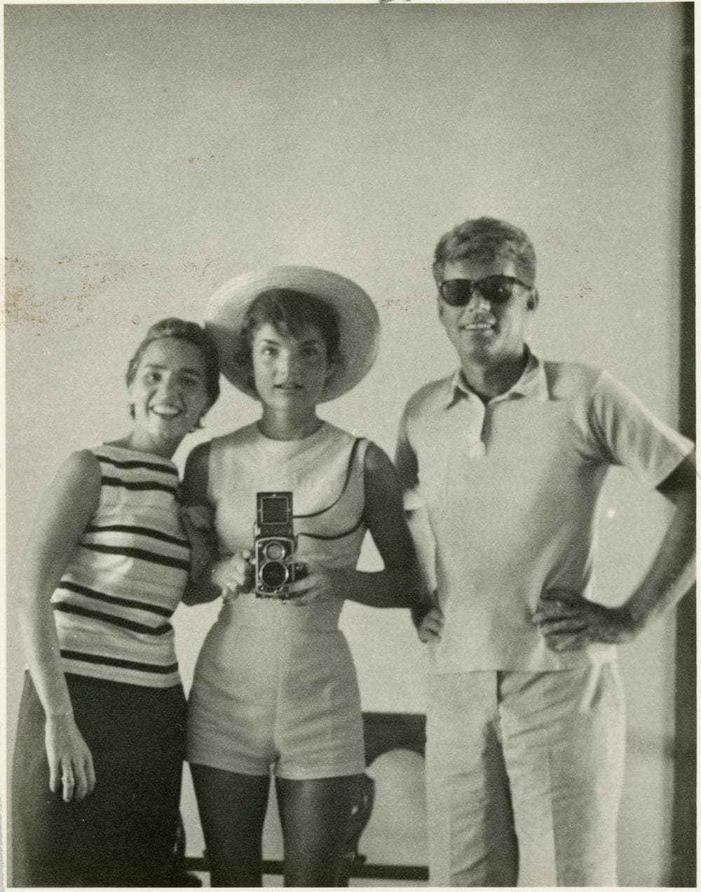 This undated photo provided by John McInnis Auctioneers shows late President John F. Kennedy, right, with his wife, Jacqueline, center, and sister-in-law Ethyl Kennedy, left. The photograph is among items to be auctioned on Sunday. (John McInnis Auctioneers/AP)