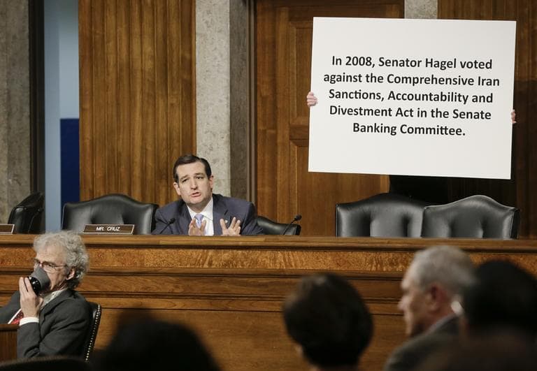 Sen. Ted Cruz, R-Texas, uses a poster while questioning Chuck Hagel, a former two-term GOP senator and President Obama's choice for defense secretary, during his confirmation hearing at the Senate Armed Services Committee on Capitol Hill in Washington, Thursday, Jan. 31, 2013. (J. Scott Applewhite/AP)