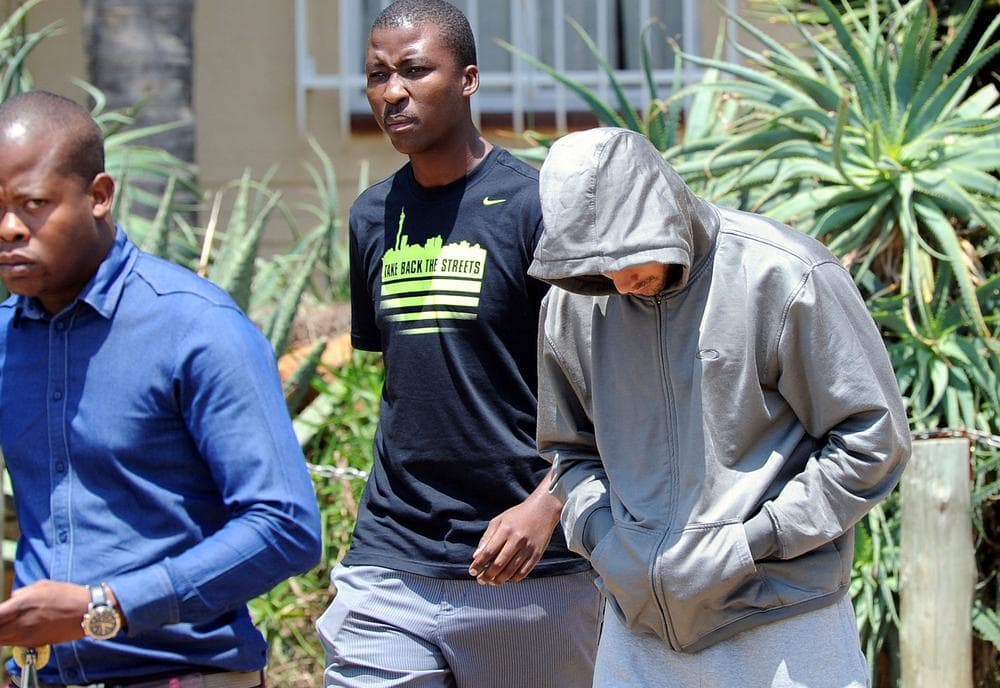 South African Olympian Oscar Pistorious (right) has been charged with murder following the death of his girlfriend Reeva Steenkamp. (Chris Collingridge/AP)