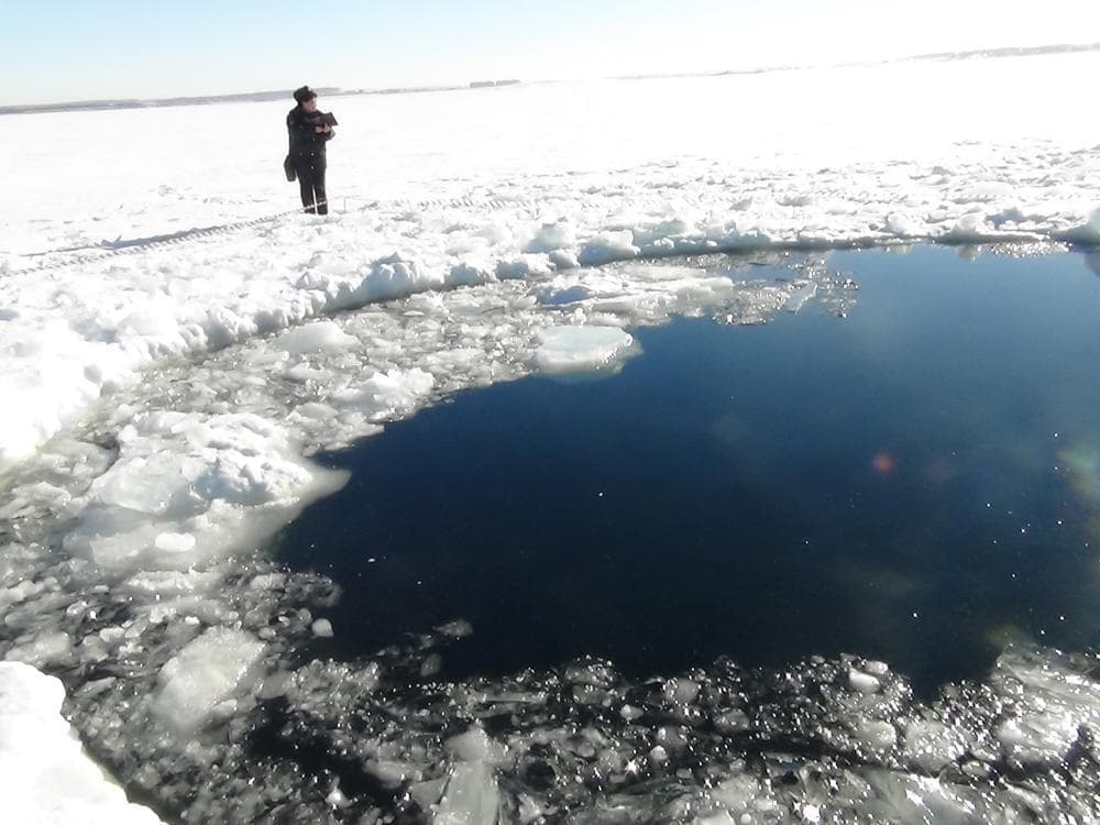 A circular hole in the ice of Chebarkul Lake where a meteor reportedly struck the lake near Chelyabinsk, about 930 miles east of Moscow, Russia, Friday, Feb. 15, 2013. (AP)