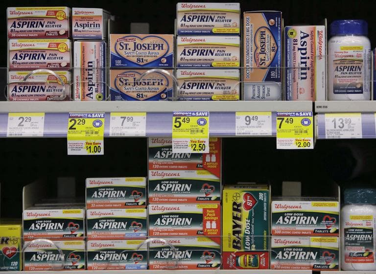 Packages of aspirin fill the shelves of a drugstore in Chicago in 2009. (M. Spencer Green/AP)