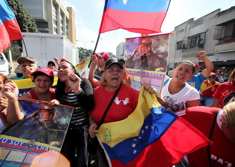 Supporters of Venezuela&#039;s President Hugo Chavez celebrate his return, outside the Carlos Arvelo Military Hospital in Caracas, Venezuela, Monday, Feb. 18, 2013. (Fernando Llano/AP)