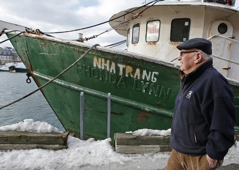 Ron Gilson, a 79-year-old lifelong Gloucester native, walks along the fish pier there. (Charles Krupa/AP)