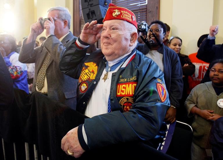 Medal of Honor recipient Jack Lucas, 80, salutes Democratic presidential hopeful Sen. Hillary Rodham Clinton, D-N.Y., as she acknowledges him during a campaign stop at the train depot in Hattiesburg, Miss, on March 7, 2008. (Carolyn Kaster/AP)