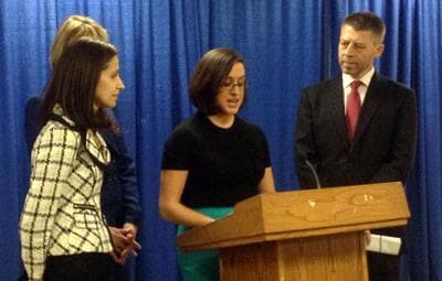 Rape survivor Lydia Cuomo (at podium) speaks at a press conference in Albany on Feb. 12, 2013 in support of a bill by Queens Assemblywoman Aravella Simotas (standing on the left) to broaden the state's legal definition of rape. Anti-abuse advocate Andrew Willis is on the right. (Office of Assemblywoman Aravella Simotas)