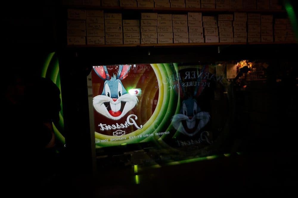 Bugs Bunny on the projection screen and the portglass in the projection room. (Jesse Costa/WBUR)