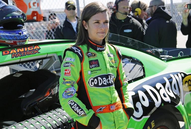 Danica Patrick stands by her car on pit road after qualifying for the NASCAR Daytona 500 Sprint Cup Series auto race at Daytona International Speedway, Sunday, Feb. 17, 2013, in Daytona Beach, Fla. (Terry Renna/AP)