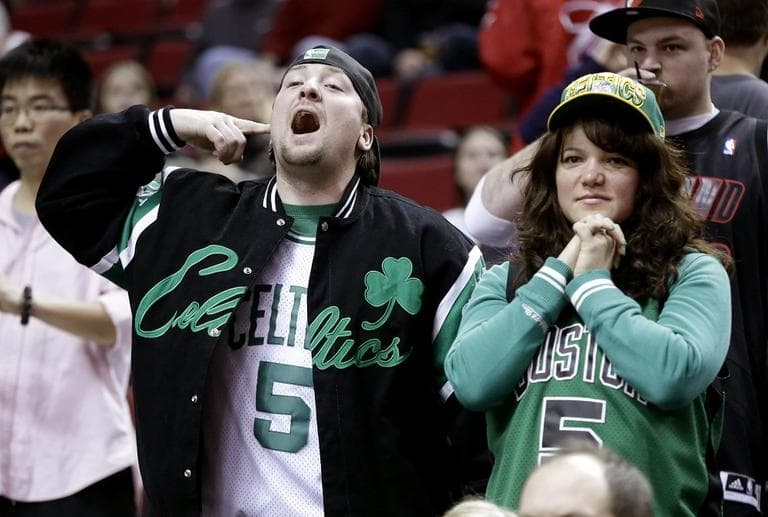 Celtics fans cheer and watch as their team is introduced during before an NBA basketball game against the Portland Trail Blazers in Portland, Ore., Sunday, Feb. 24, 2013. (Don Ryan/AP)