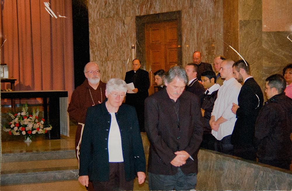 Clergy abuse survivor Bernie McDaid, front right, with Boston Cardinal Sean O'Malley in the background (Courtesy)