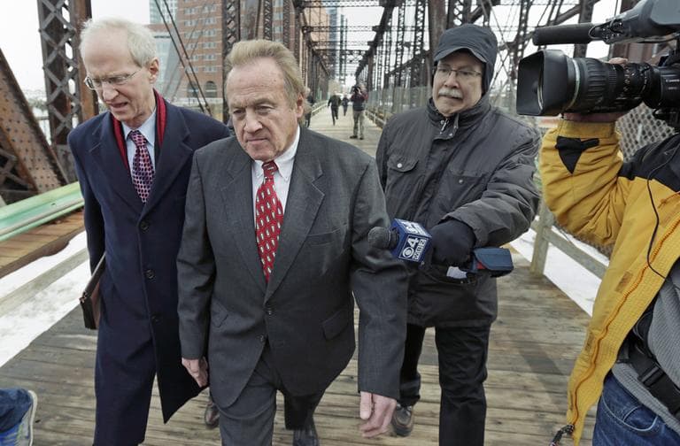Michael McLaughlin, the former director of the Chelsea, Mass. Housing Authority, center, walks with his lawyer Thomas Hoopes, left, as they leave U.S. District Court in Boston, Tuesday, Feb. 19, 2013. McLaughlin pleaded guilty to four federal counts of falsely reporting his salary. He entered a guilty plea and will be sentenced on May 14th. (AP Photo/Charles Krupa)