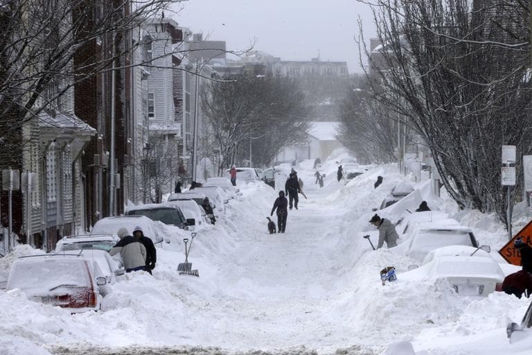 Residents on Second street in the South Boston neighborhood of Boston begin shoveling out their cars Saturday, Feb. 9, 2013 in Boston. (AP Photo/Gene J. Puskar)