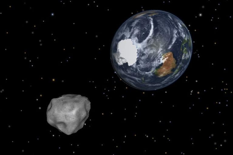 This image provided by NASA/JPL-Caltech shows a simulation of asteroid 2012 DA14 approaching from the south as it passes through the Earth-moon system on Feb. 15, 2013. The 150-foot object will pass within 17,000 miles of the Earth. NASA scientists insist there is absolutely no chance of a collision as it passes. (AP/NASA/JPL-Caltech)