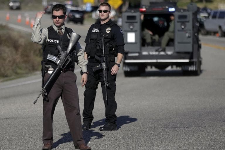 Law Enforcement personnel block Hwy 38 during the hunt for accused killer and ex-Los Angeles police officer Christopher Dorner in Yacaipa, Caif., Tuesday, Feb. 12, 2013. (AP)