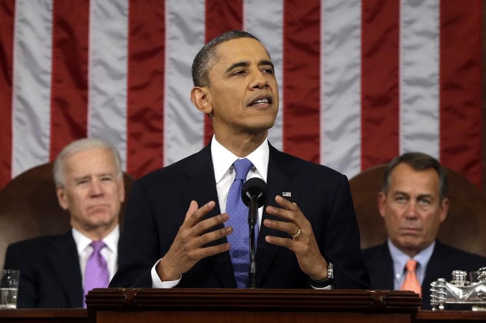 President Barack Obama, flanked by Vice President Joe Biden and House Speaker John Boehner of Ohio, gestures as he gives his State of the Union address during a joint session of Congress on Capitol Hill in Washington, Tuesday Feb. 12, 2013. (AP)
