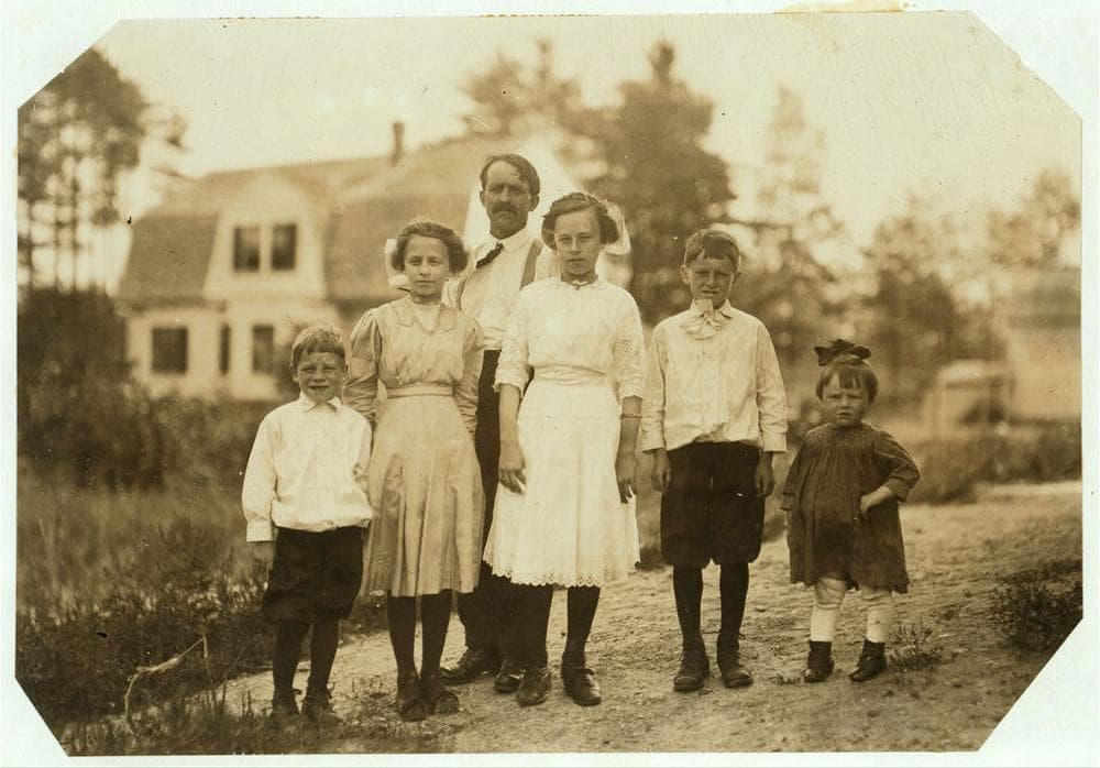 Mill worker Eva Tanguay (second from left) with her family in Lawrence in 1911, as photographed by social reformer Lewis Hine. (From the collection of the Library of Congress)