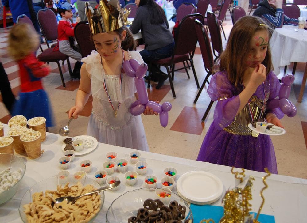 Ella Flannery (left) and Amira Laflamme sample the desserts. (Greg Cook)