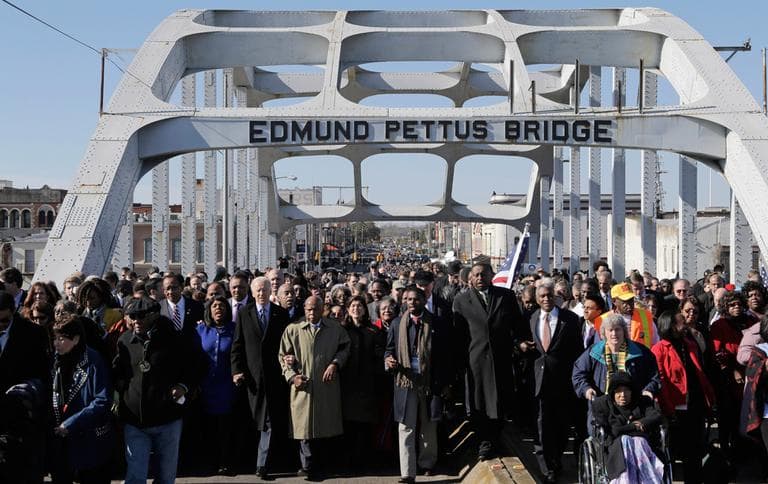 Vice President Joe Biden and U.S. Rep. John Lewis, D-Ga., lead a group across the Edmund Pettus Bridge in Selma, Ala., Sunday, March 3, 2013. They were commemorating the 48th anniversary of Bloody Sunday, when police officers beat marchers when they crossed the bridge on a march from Selma to Montgomery.(Dave Martin/AP)