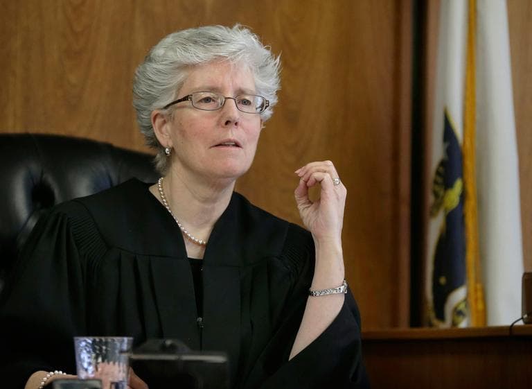 Judge Marianne Hinkle listens to an attorney in her courtroom at Woburn District Court in Woburn, Mass., Friday, March 1, 2013. Every judge in the Mass. is required to spend one week every nine months handling calls at night and on weekends. (Elise Amendola/AP)