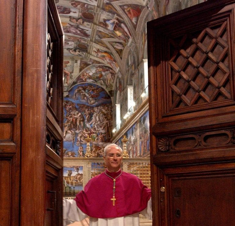 Master of Liturgical Celebrations Archbishop Piero Marini closes the door of the Sistine Chapel at the beginning of the conclave in 2005. (Osservatore Romano/AP)