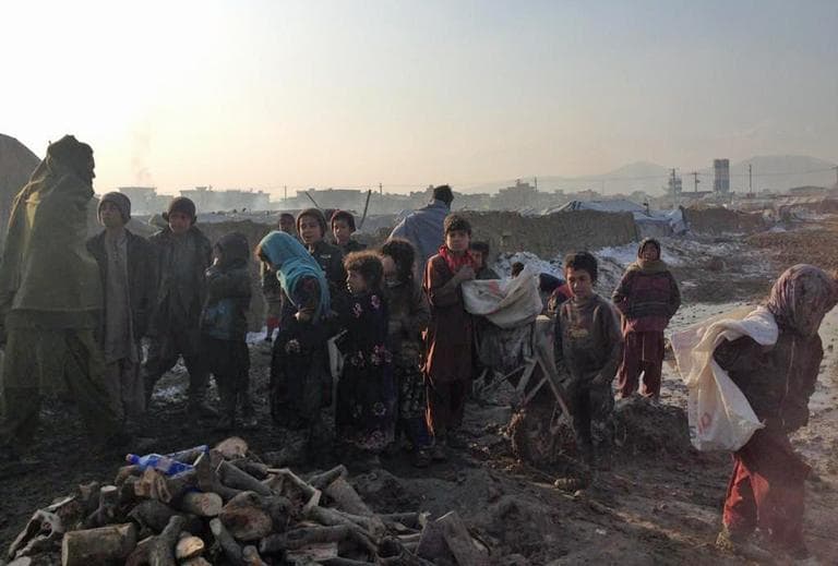 Afghan refugee children at camp Qambar in Kabul wait in line for wood distribution on January 7, 2013. (Bilal Sarwary @bsarwary/ Twitter)