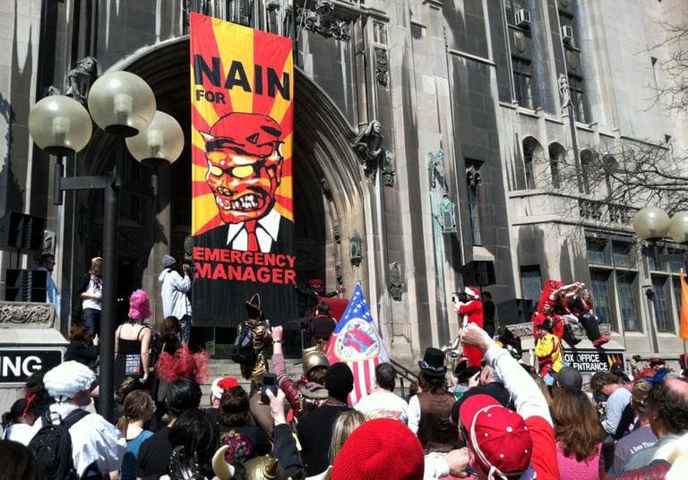 A man dressed as Detroit's mythical &quot;little red devil&quot; the Nain Rouge announces his candidacy for Detroit emergency manager at the &quot;Marche Du Nain Rouge&quot; festivites last year in Detroit. (Julie Phenis/Facebook)