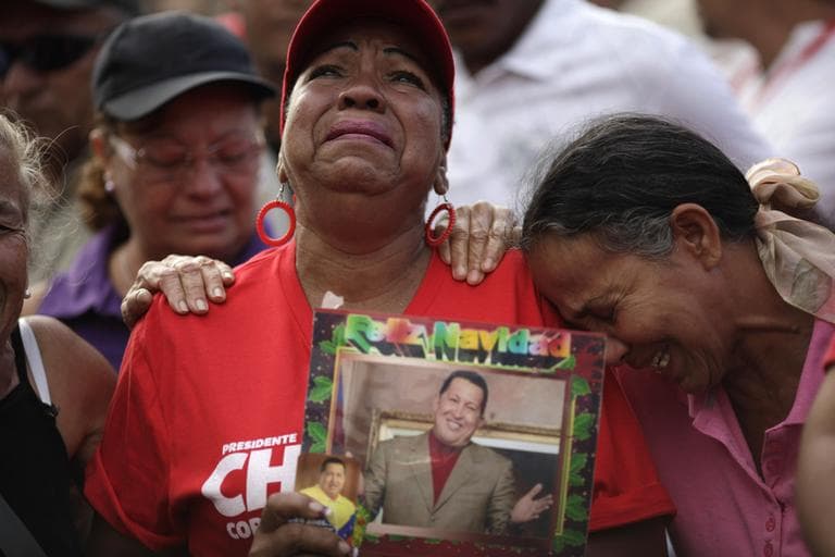 Supporters of Venezuela's President Hugo Chavez cry outside the military hospital where President Hugo Chavez, aged 58, died on Tuesday in Caracas, Venezuela, Wednesday, March 6, 2013. (Ariana Cubillos/AP)