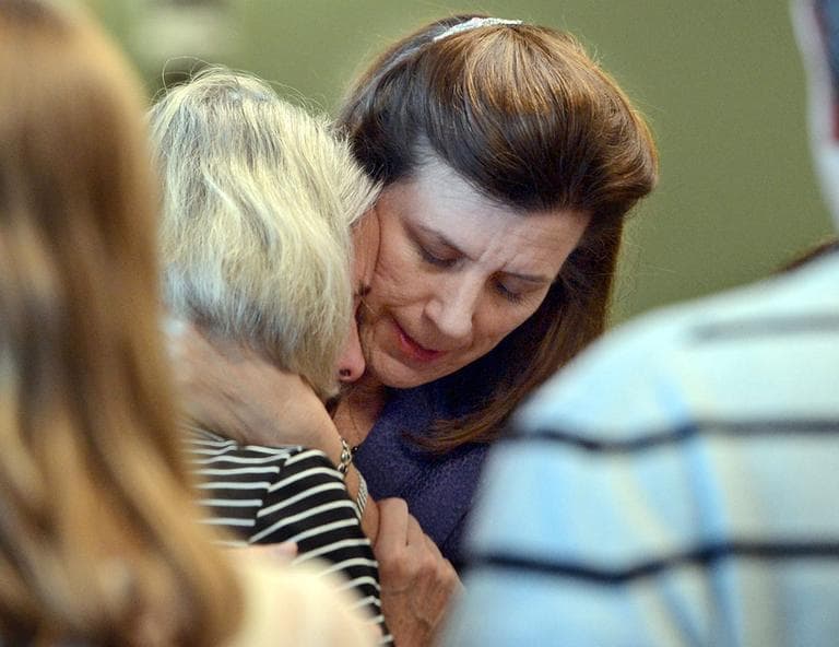 Prosecutor Lisa McGovern, right, hugs Mary Dunne, mother of Lauren Astley, after a jury found Nathaniel Fujita guilty of first-degree murder in the July 2011 killing of Astley, his former girlfriend. (MetroWest Daily News/AP, Pool)