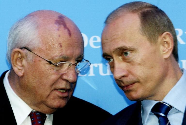 Russia's President Vladimir Putin, right, talks with former Soviet President Mikhail Gorbachev at the start of a news conference in northern Germany, Dec. 21, 2004, following the German-Russian summit. (Heribert Proepper/AP)