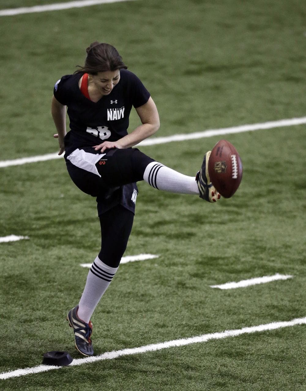 Lauren Silberman grimaces as she kicks  during an NFL football regional combine workout on March 3. (Mel Evans/AP)