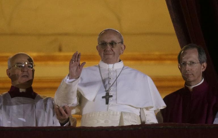 Pope Francis waves to the crowd from the central balcony of St. Peter's Basilica at the Vatican, Wednesday, March 13, 2013. (Gregorio Borgia/AP)