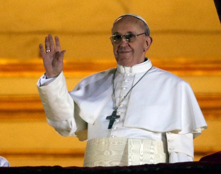Pope Francis waves to the crowd in St. Peter's Square at the Vatican on Weds., March 13, 2013. (AP) 