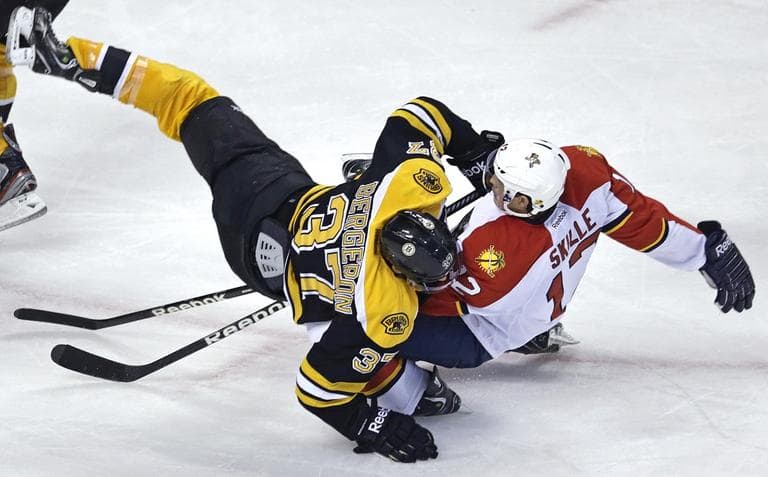 Bruins center Patrice Bergeron (37) collides with Florida Panthers right wing Jack Skille (12). (AP/Charles Krupa)