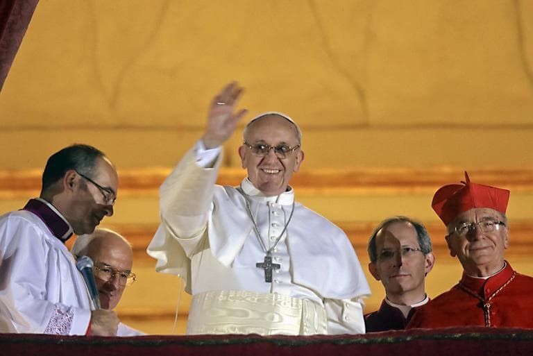 Pope Francis waves to the crowd from the central balcony of St. Peter's Basilica at the Vatican, Wednesday, March 13, 2013. (Gregorio Borgia/AP)