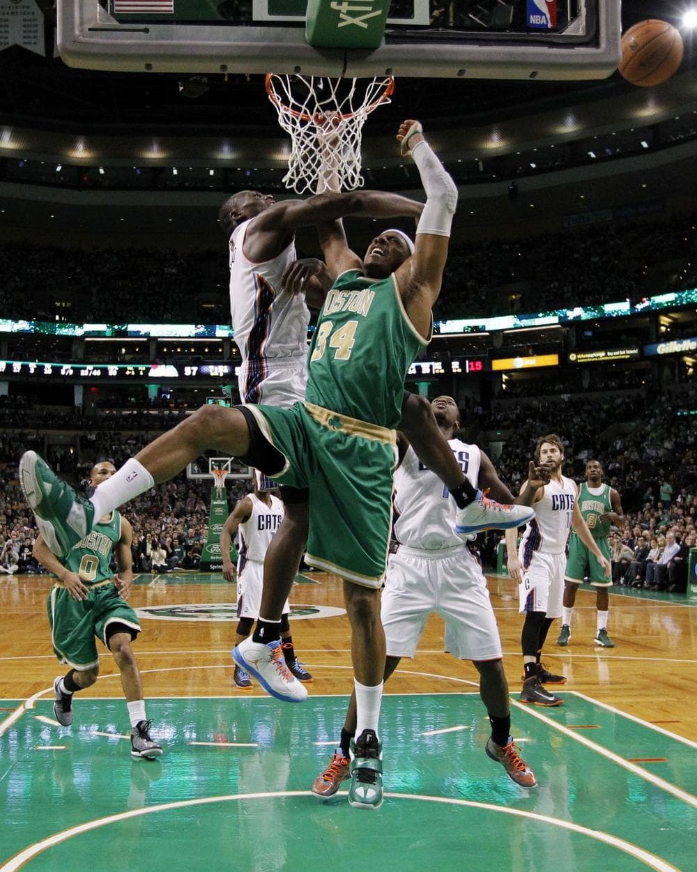 Charlotte Bobcats' Bismack Biyombo (0) blocks a shot byPaul Pierce (34) in Boston, Saturday, March 16, 2013. The Celtics won 105-88. (AP Photo/Michael Dwyer)