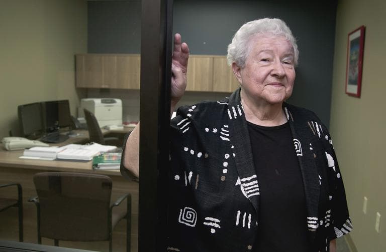 Janice Durflinger poses for a photo at her workplace in Lincoln, Neb., in August 2012. Durflinger is still working at age 76, running computer software programs for a bank. Still, she worries that a higher retirement age would be tough on people with more physically demanding jobs. (Nati Harnik/AP)