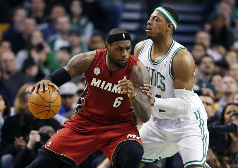 LeBron James looks to move past Paul Pierce in the first quarter. (AP)