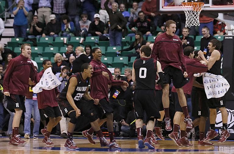 Harvard players run off the bench and celebrate after beating New Mexico during a second round game in the NCAA college basketball tournament in Salt Lake City Thursday. (George Frey/AP)