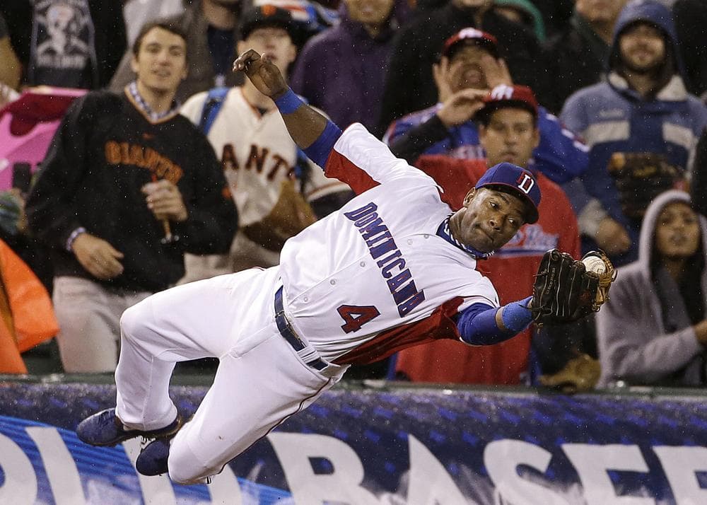 Fans who didn't watch this year's World Baseball Classic missed out on this catch by Miguel Tejada and other great plays. (Eric Risberg/AP)