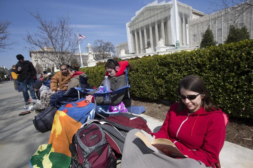 Dozens have been camping out for days in front of the U.S. Supreme Court for a seat to watch oral arguments in a same-sex marriage case that start Tuesday. (Jacquelyn Martin/AP)
