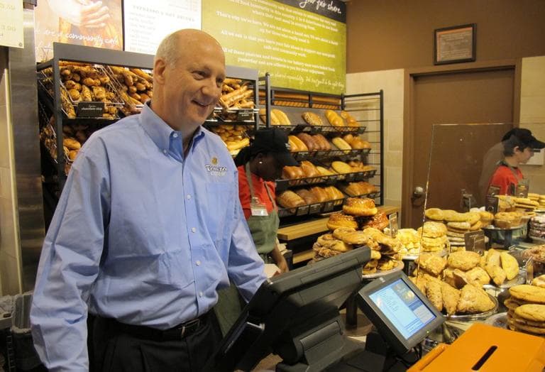 Panera founder and co-CEO Ron Shaich works the register at Panera Cares in Boston. (Kevin Sullivan/Here &amp; Now)