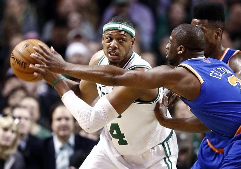 Boston Celtics' Paul Pierce, left, looks for an opening against New York Knicks' Raymond Felton. (AP/Winslow Townson)