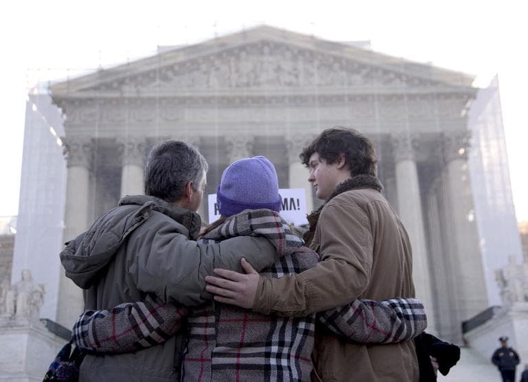 A group from Alabama prays in front of the Supreme Court in Washington, Wednesday, March 27, 2013, before the court's hearing on the Defense of Marriage Act (DOMA). (AP/Carolyn Kaster)