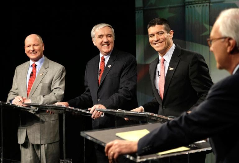 Republican U.S. Senate hopefuls, from left, Norfolk state Rep. Daniel Winslow, former U.S. Attorney Michael Sullivan and Cohasset businessman Gabriel Gomez react as they listen to debate moderator R.D. Sahl at the WCVB-TV studios in Needham on Wednesday. (Steven Senne/AP)