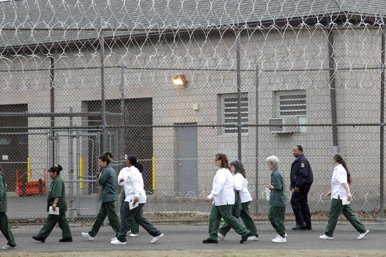 Women walk on a road at the women-only Taconic Correctional Facility in Bedford Hills, N.Y., Wednesday, March 28, 2012.  (Seth Wenig/AP)