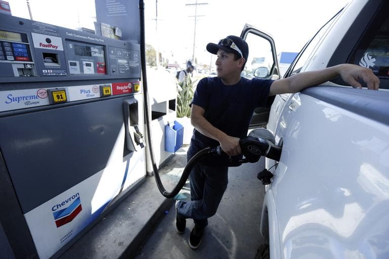 Chris King fills up his truck at a gas station in San Diego, in February 2013. (Gregory Bull/AP)