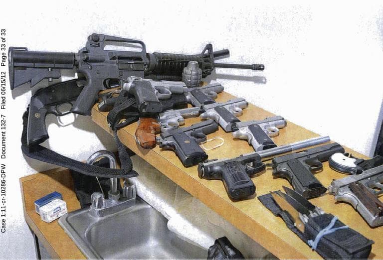This 2011 photo provided by the U.S. Attorney's office shows guns displayed in the Santa Monica, Calif., apartment where Whitey Bulger and Catherine Greig hid before their arrest in June 2011. The photo was among hundreds of documents unsealed by prosecutors Friday, June 15, 2012, three days after Greig was sentenced in Boston to eight years in prison for helping Bulger during his years as a fugitive.  (AP Photo/U.S. Attorney's Office)
